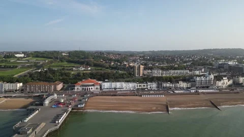 Aerial view of the seafront, beach and pier at Hastings Stock Footage 242914340