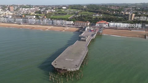Aerial view of the seafront, beach and pier at Hastings Video stock 242914409