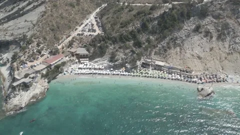 Aerial view of Seagull Beach with turquoise water and cliffs in Ksamil, Albania Stock Footage 344859813