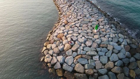 Aerial View of Seaside Breakwater Structure - Calm Mediterranean Waters Stock Footage 263028980
