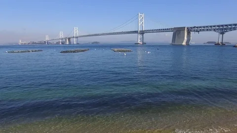 Aerial view of seaside with large bridge Stock Footage 77462898