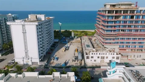 Aerial view of seaside resort with multiple hotel complexes near ocean coast Stock Footage 245955470