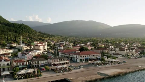 Aerial view of the seaside town on a sunset. Seaside town in Greece. Stock Footage 283287743