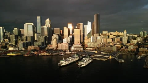Aerial View of Seattle with Storm Clouds at Golden Hour Stock Footage 348416227