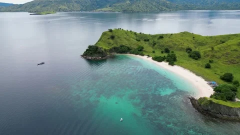 Aerial View of Secluded Beach and Clear Coral Waters in Indonesia Stock Footage 314987745