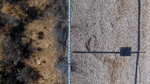 Aerial view of a security fence with razor ribbon Stock Footage 71500640