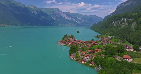 Aerial view of the Seeburg an castle on the lake. Aerial view of Iseltwald on Video stock 302100053