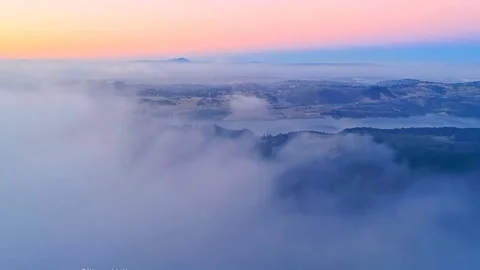 Aerial view of seeing a small road in thick fog with heavy car traffic Stock Footage 145355789
