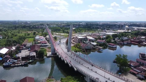 Aerial view of the Sei Alalak Bridge located in Banjarma Stock Footage 274473056
