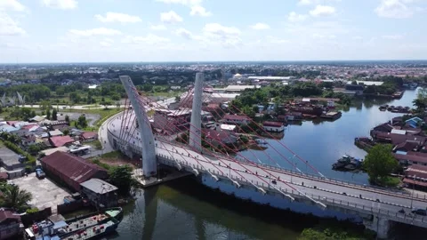 Aerial view of the Sei Alalak Bridge located in Banjarmasin which is known as th Stock Footage 274473093