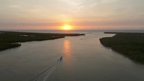 Aerial view of serene sunset over river and boat, Mexico. Stock Footage 284847844