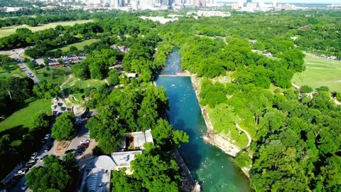 Aerial View of Serpentine River Winding Through Lush Green Landscape Vidéo 311654559