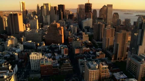 Aerial view of the Setting Sun over Manhattan and Iconic Skyscrapers, NY, USA Stock Footage