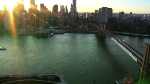 Aerial view of the Setting Sun over Manhattan and the Brooklyn Bridge, NY, USA Stock Footage 7414221