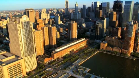 Aerial view of the Setting Sun over Manhattan and Iconic Skyscrapers, NY, USA Stock Footage