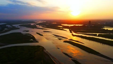 Aerial view of the setting sun on the river Stock Footage 296369685