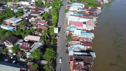 Aerial view of settlements on the banks of the river and densely populated .. Stock Footage 319971210