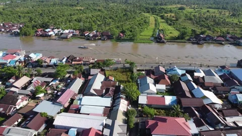 Aerial view of settlements on the banks of the river and densely populated .. Stock Footage 319971344