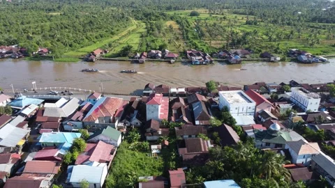 Aerial view of settlements on the banks of the river and densely populated .. Stock Footage 319971453