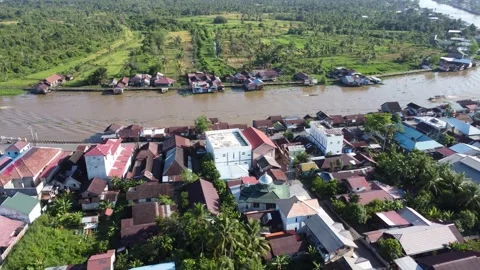 Aerial view of settlements on the banks of the river and densely populated .. Stock Footage 319971601