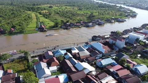 Aerial view of settlements on the banks of the river and densely populated .. Stock Footage 319971703