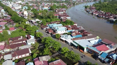 Aerial view of settlements on the banks of the river and densely populated .. Stock Footage 319971925
