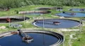 Aerial view of several sedimentation basins with scrapers for sewage cleaning HD Footage