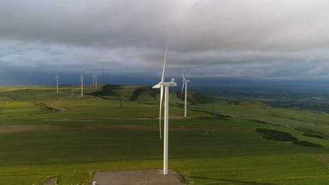 Aerial view. Several wind turbines rotate among the fields and hills. 스톡 동영상 93624764