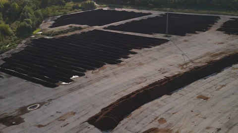 Aerial view of sewage sludge composting windrows on industrial site Vídeos de archivo 344349865