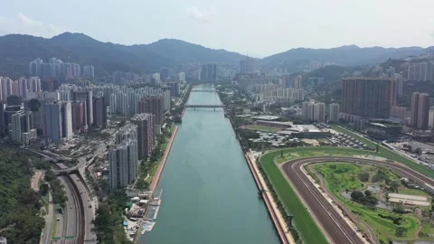 Aerial view of Sha Tin. Shing Mum River and Jockey Club. with no racing on ta Stock-Footage 130228406