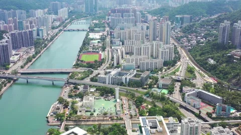 Aerial view of Sha Tin. Shing Mum River and Jockey Club. with no racing on ta Stock-Footage 130228528