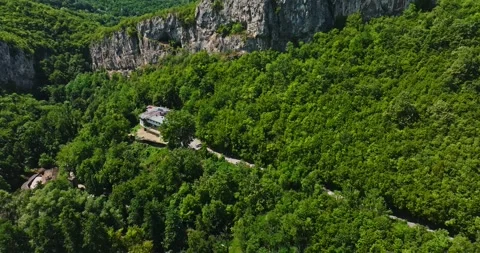 Aerial View Of Sharp Cliff In Rural Bulgaria Hot Summer Day Drone Descend Tilt Stock Footage 300444262