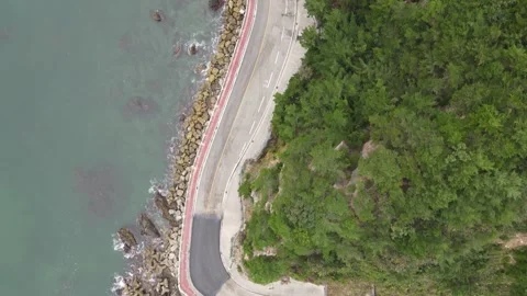 Aerial View of Sharp Curve on Scenic Coastal Road in South Korea Stock Footage 343195125