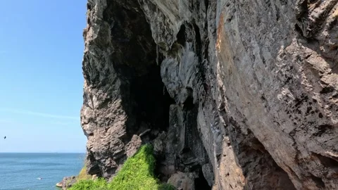 Aerial View of Sharp Massive Cliff with Adaman Sea and Boat in Thailand Stock Footage 339905476