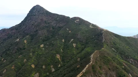 Aerial view of Sharp Peak, countryside and hiking route in Sai Kung, Hong Kon Stock Footage 123882124