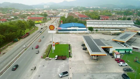 Aerial view of a Shell petrol station beside a major highway. Stock Footage 336569746
