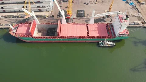 Aerial view of the ship loading near the berth in the port. Loading the wire rod Stock Footage 88359046