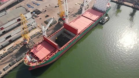 Aerial view of the ship loading near the berth in the port. Loading the wire rod Stock Footage 88365432