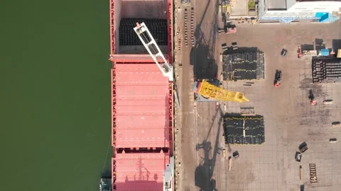 Aerial view of the ship loading near the berth in the port. Loading the wire rod Stock Footage 88379942