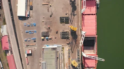 Aerial view of the ship loading near the berth in the port. Loading the wire rod Stock Footage 88385899