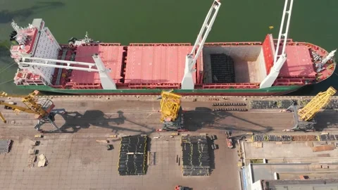Aerial view of the ship loading near the berth in the port. Loading the wire rod Stock Footage 88386918
