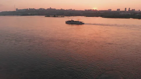Aerial view of the ship sailing on the river in the city at sunset. 스톡 동영상 92808939