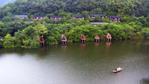 Aerial view of ship-shaped architecture by river Stock Footage 196018540