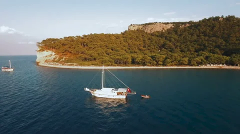 Aerial View of Ship Which Tows a Boat in Sea Bay Stock Footage 68720901