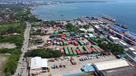Aerial view of a shipping container yard by the sea 4k Stock Footage 265083021