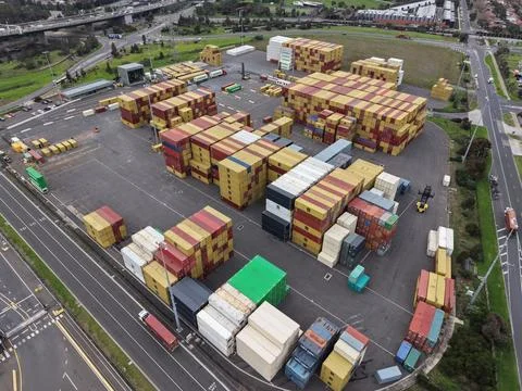 Aerial view shipping containers stacking at industrial freight terminal Stock Photos