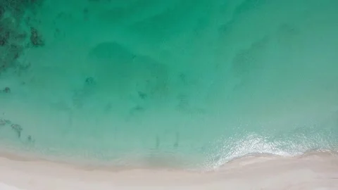 Aerial view shot. Drone camera over white beach sand and sew water clear. N.. Stock Footage 233794527