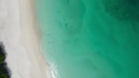 Aerial view shot. Drone camera over white beach sand and sew water clear. N.. Stock Footage 233794571