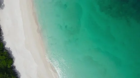 Aerial view shot. Drone camera over white beach sand and sew water clear. N.. Stock Footage 233794742