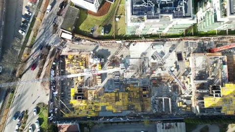 Aerial view showcasing the dynamic construction progress of a modern house in an Video stock 329964472
